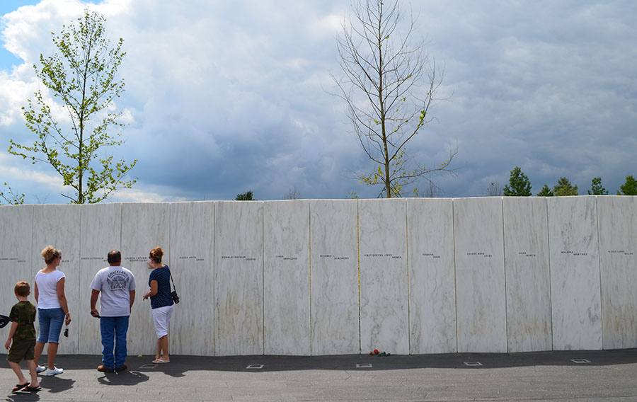 Four visitors walk by the wall of names at the Flight 93 National Memorial in southwestern Pennsylvania.
