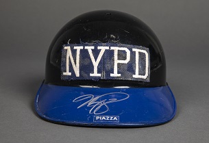 A black baseball helmet with NYPD lettering worn and a blue bill was worn by New York Mets player Mike Piazza after 9/11 and was donated to the 9/11 Memorial Museum's collection.