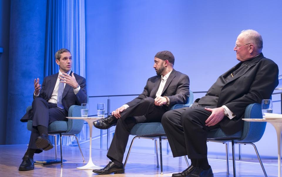 Rabbi Elliot Cosgrove, Imam Khalid Latif and Cardinal Timothy Dolan sit onstage at the Museum Auditorium during a public program on interfaith dialogue.