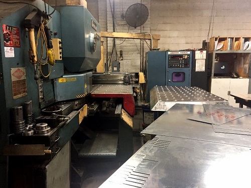 This punch press machine at National Elevator Cab and Door Corporation dates from 1981. It was one of the first of its kind in the United States, and was at long last retired and replaced with a newer machine this fall.