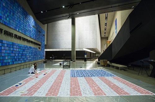 Valerie Soll and Lisa Conte in the gallery humidifying and flattening creases. Photo by Jin Lee, 9/11 Memorial.