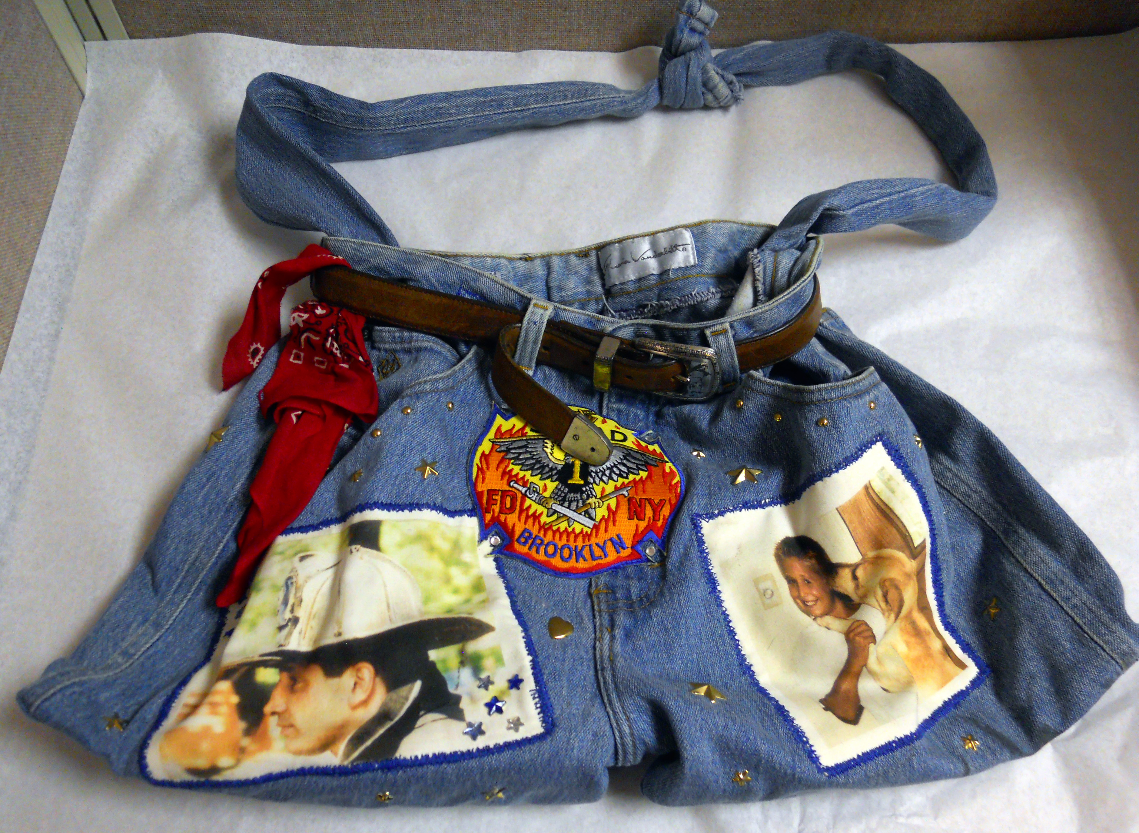 FDNY Lieutenant Michael A. Esposito is remembered on a bag made of blue jeans. The bag includes a photo of Esposito in uniform, as well as a fire patch and a photo of a young girl with a dog.