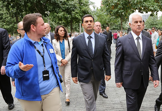 Daniel Castorina gives a tour to Devis Eroglu, the president of Northern Cyprus, at 9/11 Memorial plaza.
