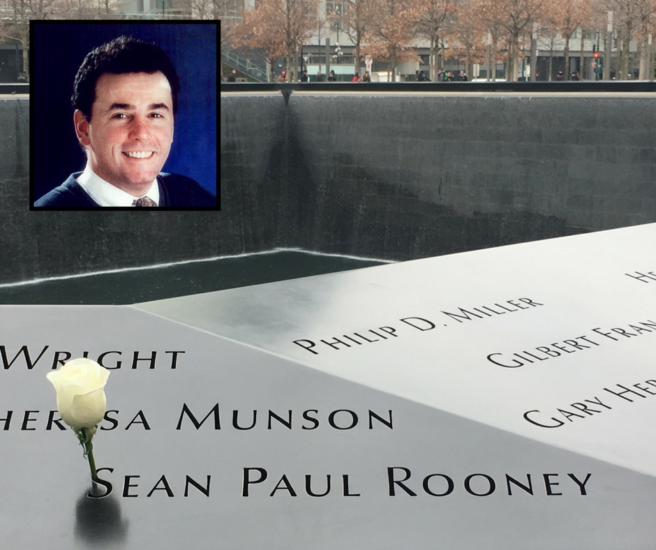 A white rose has been placed at the name of Sean Paul Rooney on the Memorial. An inset image shows Rooney smiling for a professional photo.