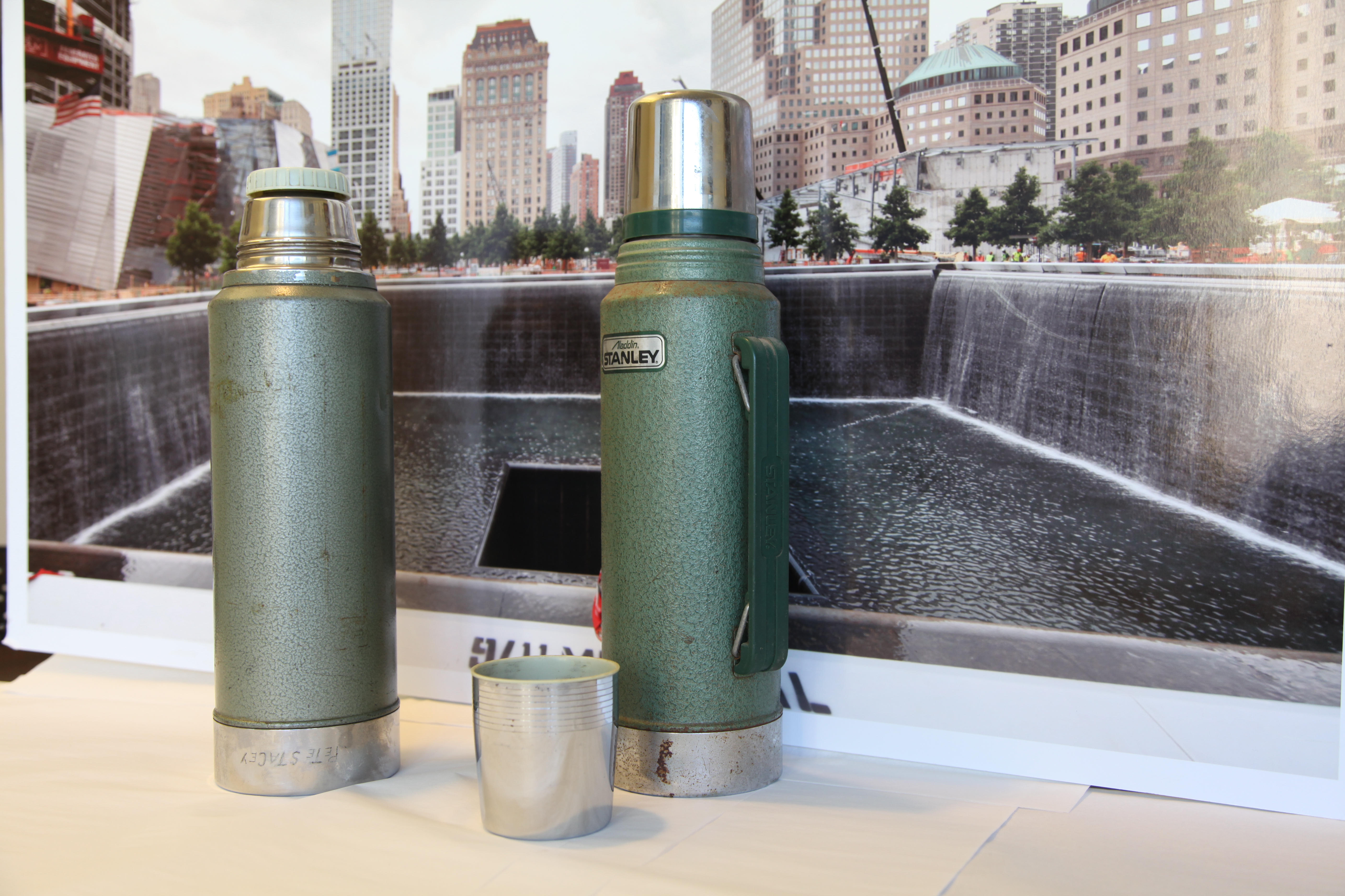 Two green thermoses belonging to Mohawk Indian ironworkers are displayed on a table at the Museum.