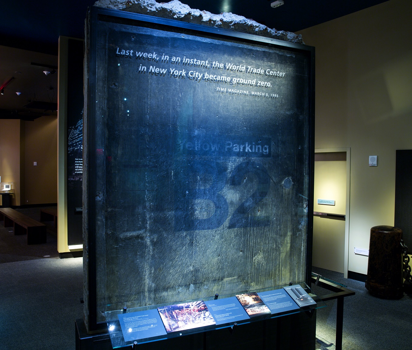 A slab of concrete from the parking garage at the World Trade Center is displayed in a part of the 9/11 Memorial Museum documenting the 1993 bombing. The concrete reads “Yellow Parking B2.”