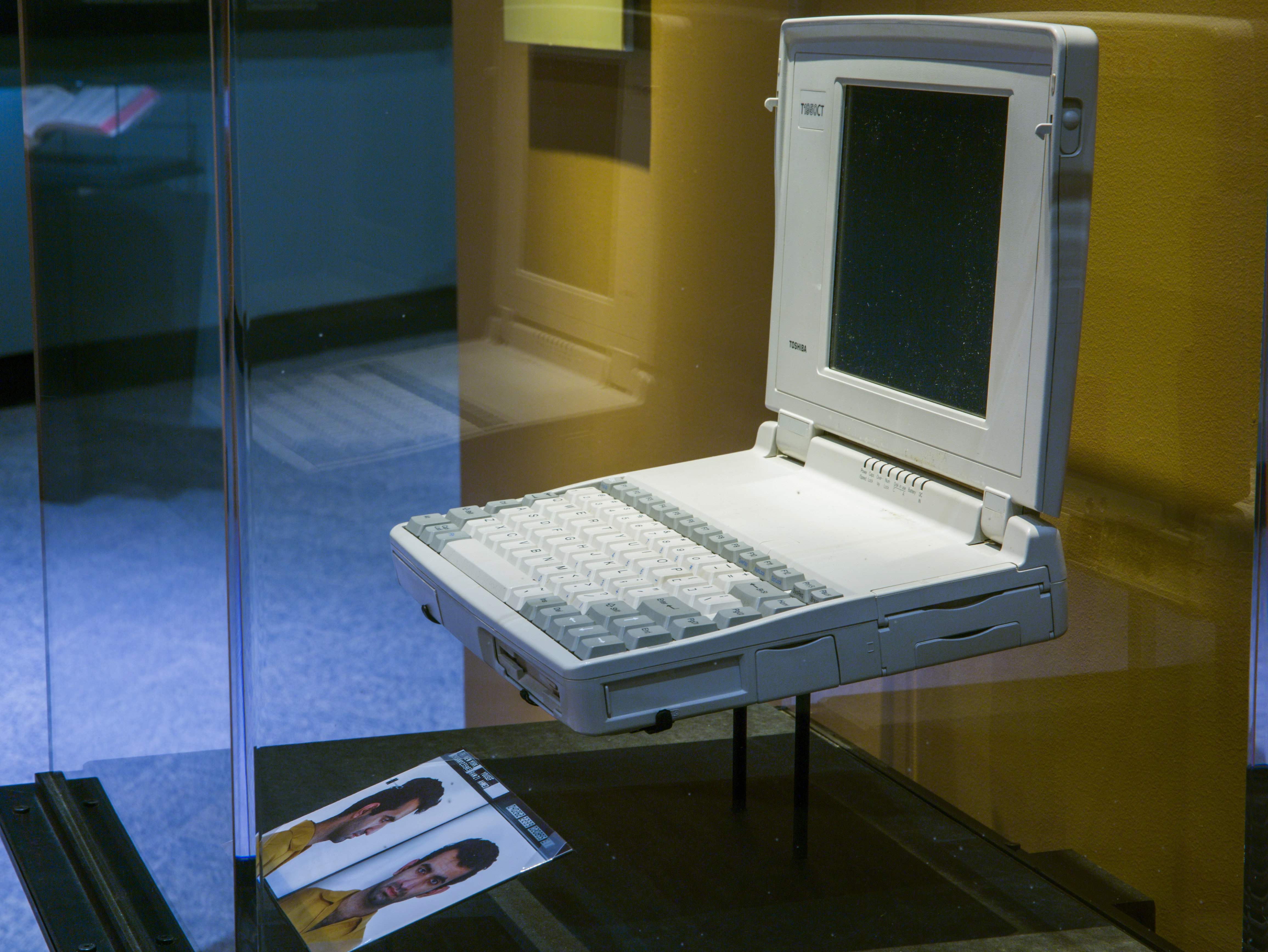 A laptop computer belonging to terrorist Ramzi Yousef is seen in a display case at the Museum’s Historical Exhibition. The laptop is an older model, dating back to at least the early 1990s. An image of Yousef is displayed below it.