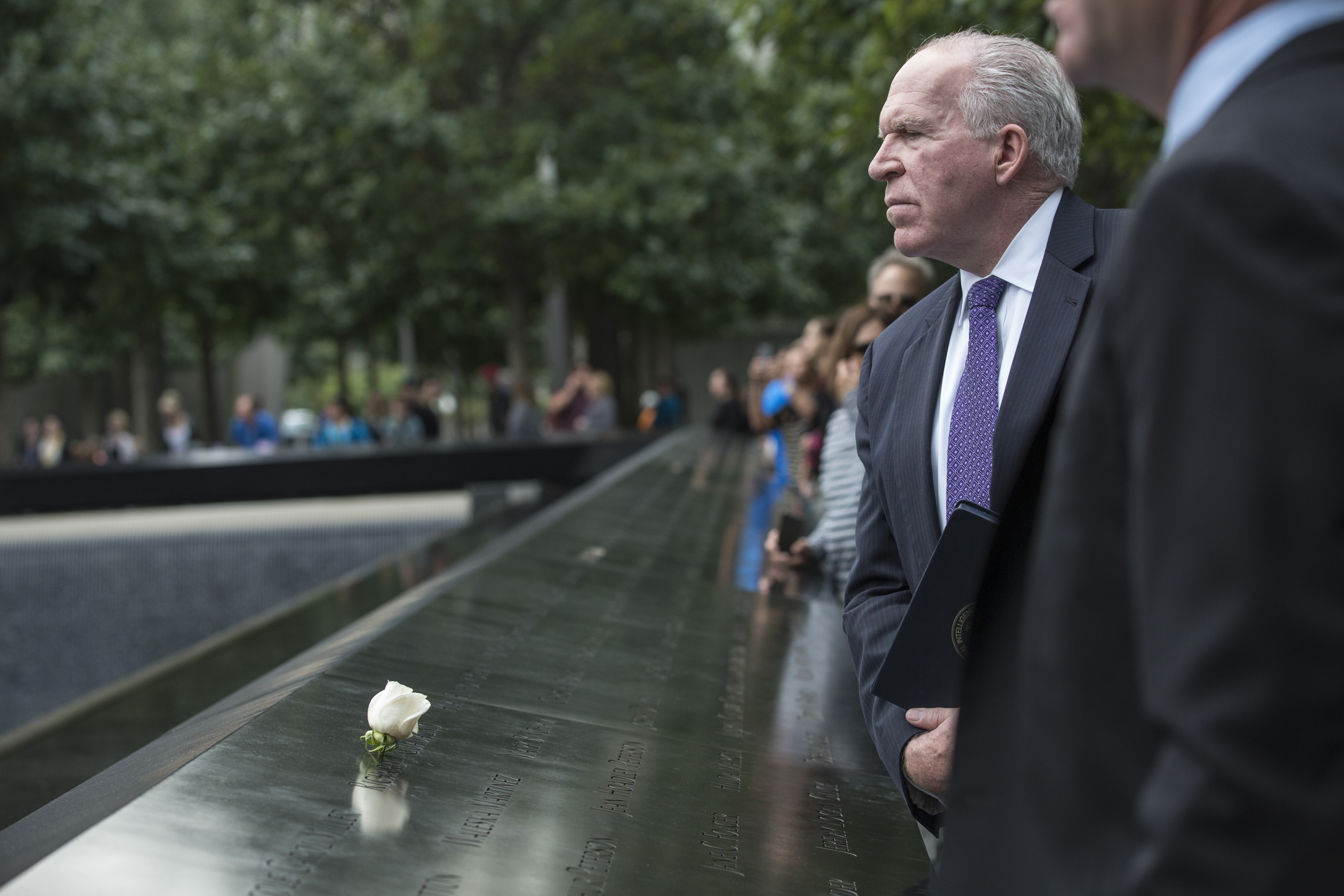 CIA Director John Brennan tours the 9/11 Memorial with President Joe Daniels before speaking at a public program.