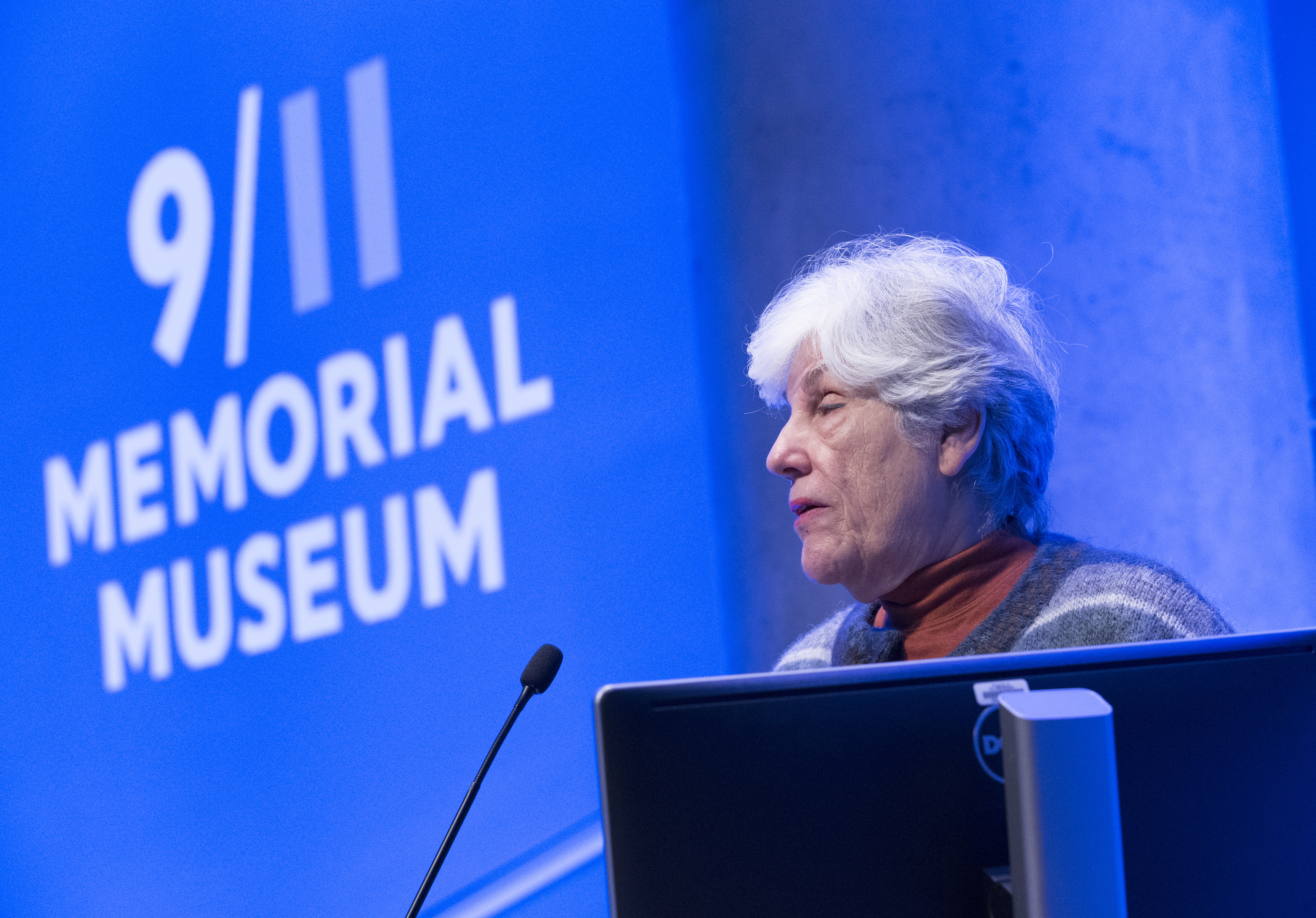 Ellen Karas speaks at a podium in the Museum’s Auditorium.