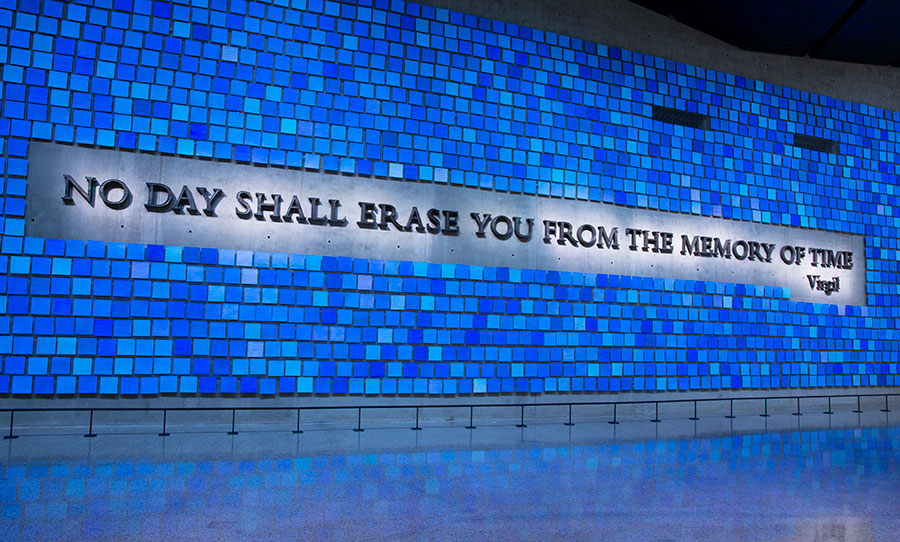 Artist Spencer Finch’s installation “Trying to Remember the Color of the Sky on That September Morning” is seen in Memorial Hall. The installation features the Virgil quote “No day shall erase you from the memory of time.” The plaque is surrounded by 2,983 watercolor squares, each their own shade of blue.