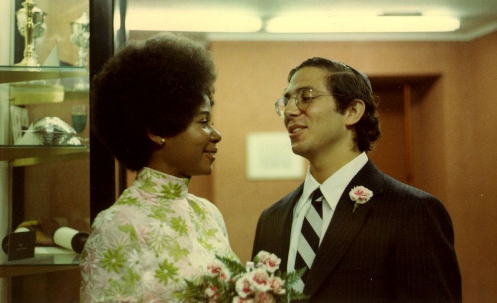 Granvilette and Howard Kestenbaum smile at one another on their wedding day.