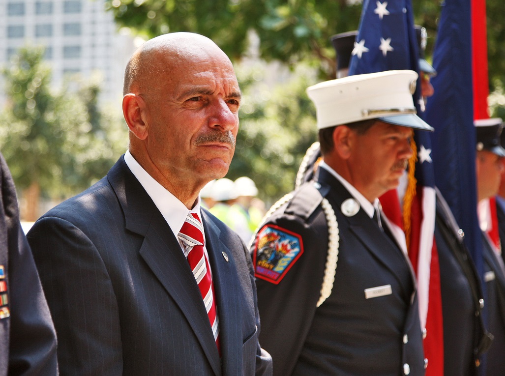 Retired FDNY Commissioner Sal Cassano stands next to other firefighters during a ceremony at the 9/11 Memorial.