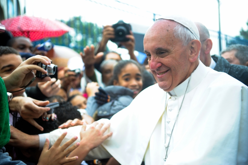 Pope Francis greets visitors in Varginha, Brazil.