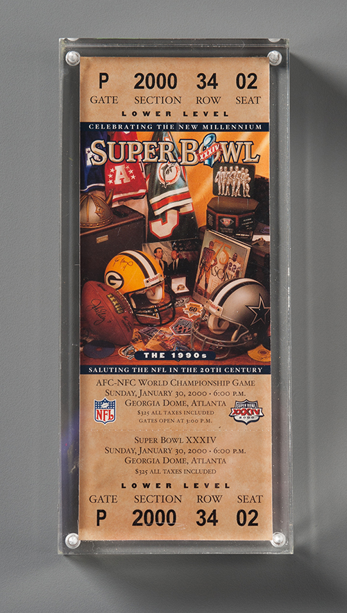 A ticket to Super Bowl XXXIV in 2000 is displayed at the Museum. It was donated in the memory of Timothy G. Byne by his sister, Kathleen.