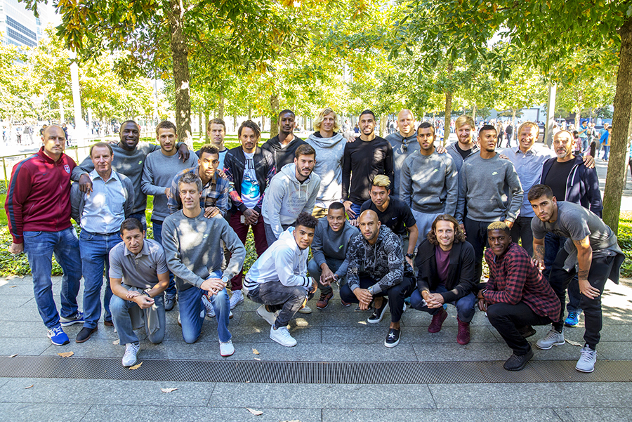 The U.S. men’s national soccer team poses for a photo during their visit to the 9/11 Memorial.