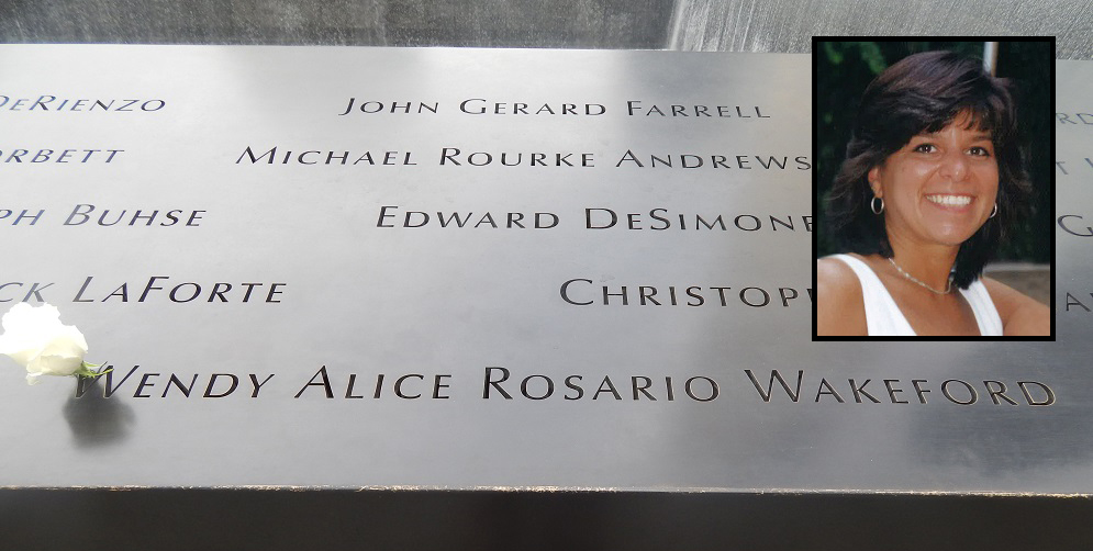 A white rose has been placed on the name of Wendy Wakeford at the 9/11 Memorial. An inset photo shows Wakeford smiling.