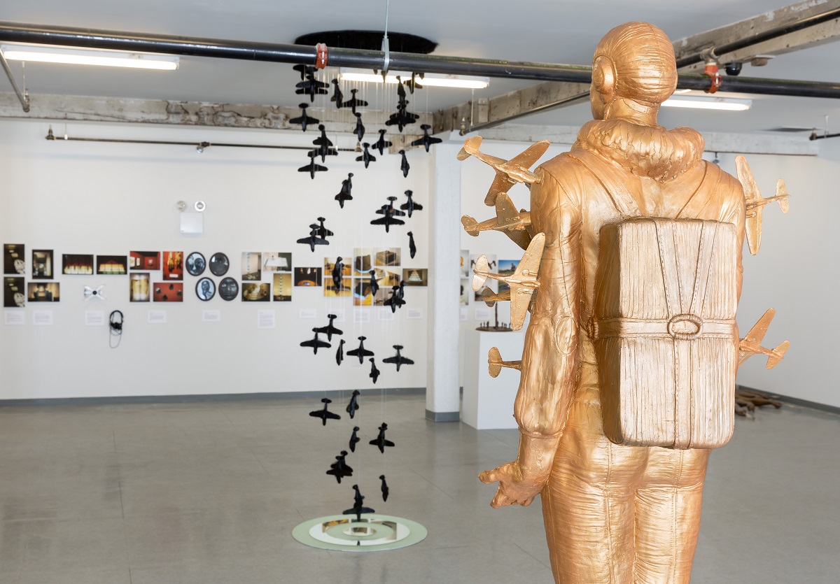 An art exhibit dedicated to 9/11 victim Michael Richards is seen at the LMCC Arts Center on Governors Island. Many of the pieces in the exhibit are related to flight and flying, including a gold-colored statue depicting an aviator surrounded by planes.