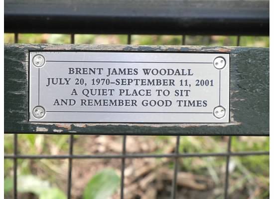 A bench in Central Park features an inscription in memory of 9/11 victim Brent Woodall.