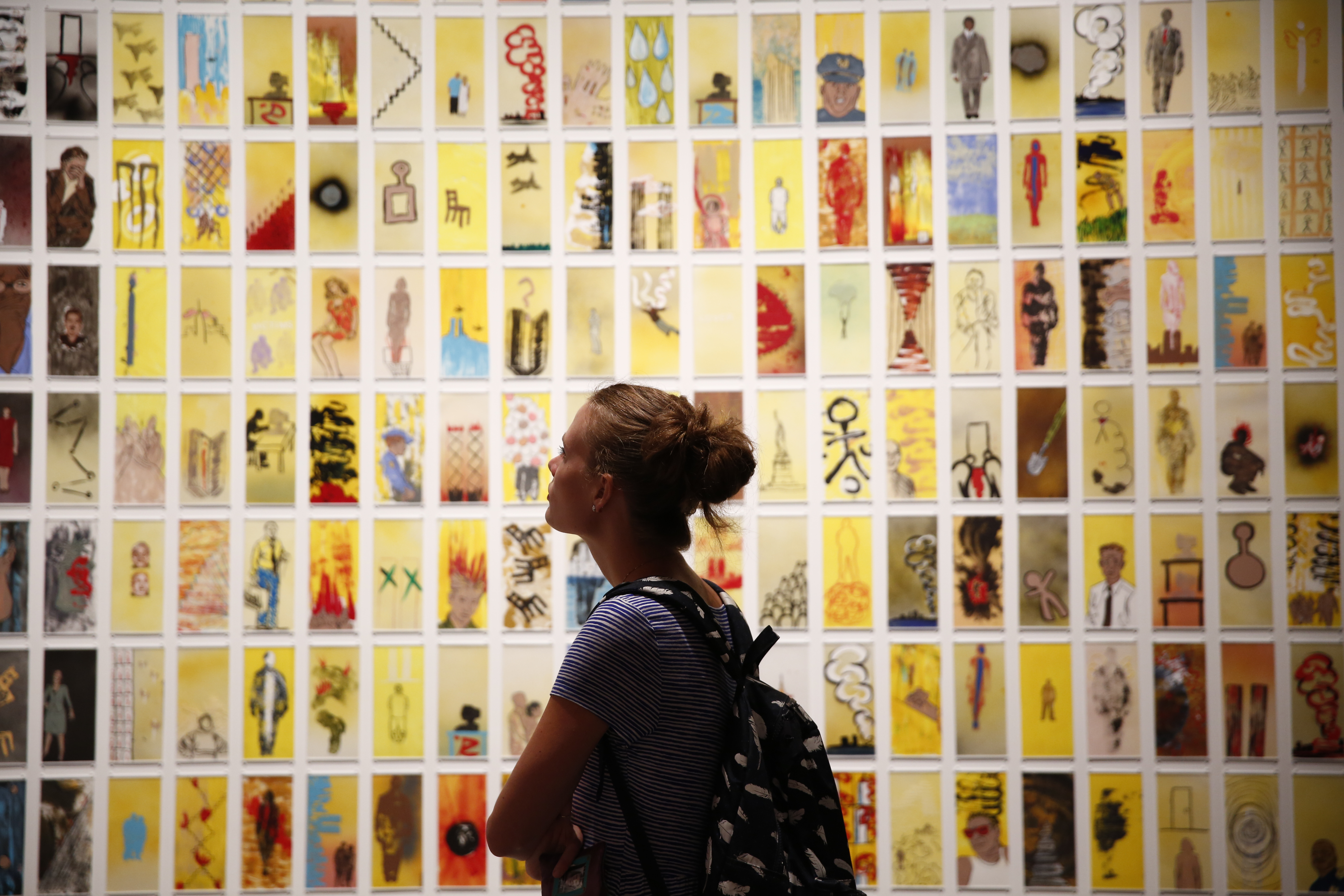 A woman views the 9/11 Memorial Museum’s exhibition, Rendering the Unthinkable. The work features dozens of works created by artists in response to 9/11.