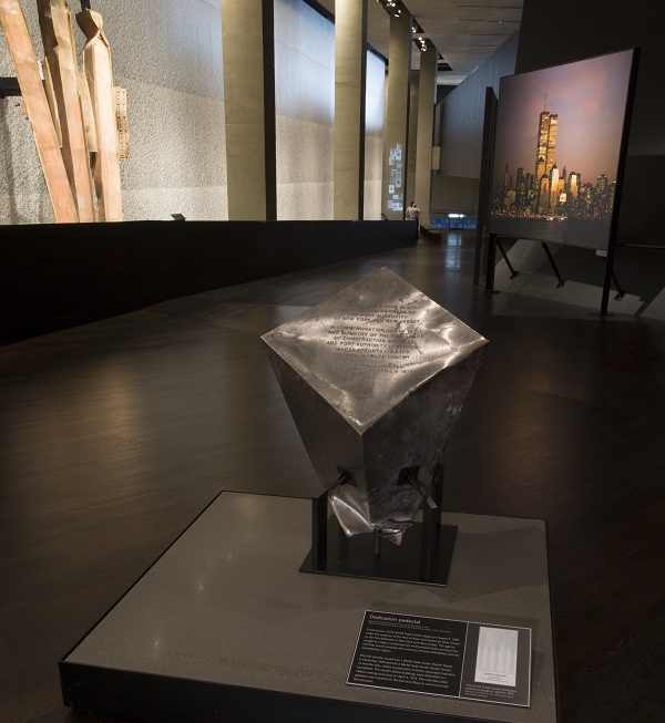 A stainless-steel pedestal that commemorated the dedication of the World Trade Center site in 1973 is displayed at the 9/11 Memorial Museum. The pedestal survived the 9/11 attacks.