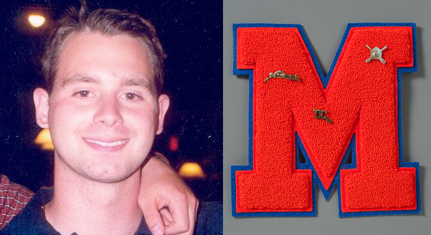 Paul Cascio, a victim of 9/11, smiles in an old photo. His varsity letter from Manhasset Secondary School on Long Island is displayed on a gray surface. It is a red M with a blue border adorned with pins for swimming, baseball, and cross country.