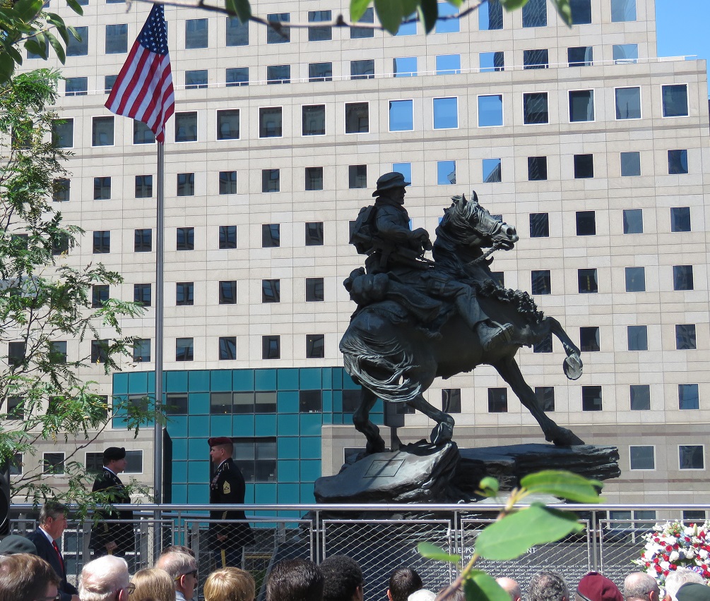 The “Horse Soldier” statue towers over visitors during its dedication ceremony in Liberty Park.