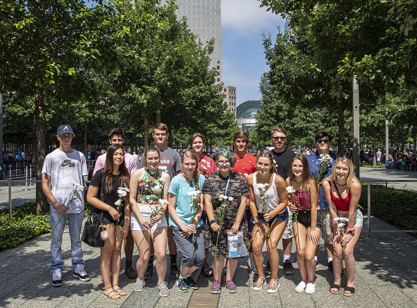 A group of teenagers, all of whom were born on September 11, 2001, pose for a photo on Memorial plaza.