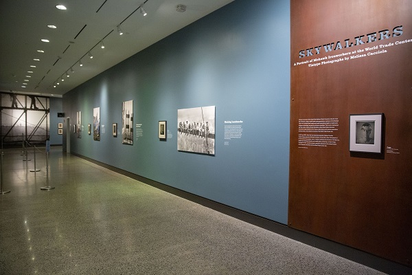 A view of the Museum’s South Tower Gallery shows the special exhibition “Skywalkers.” Tintype photos along the wall capture Mohawk members of the Local 40 ironworker’s union.