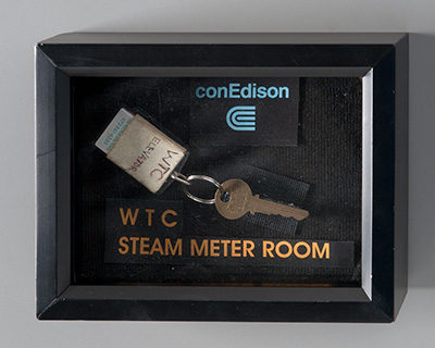A key and key tag to the World Trade Center steam meter room is displayed in a case.