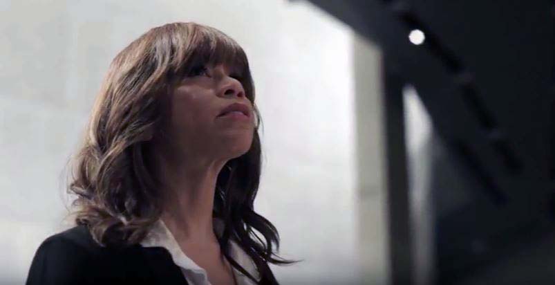 Rosie Perez looks up as she stands in the Museum.