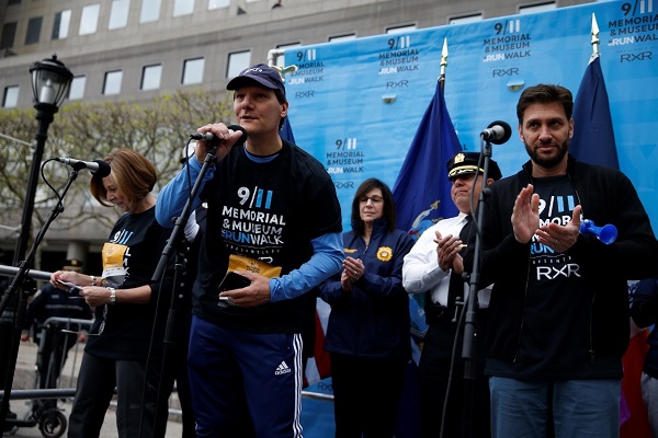 Alice M. Greenwald, president and CEO of the 9/11 Memorial & Museum, stands beside Michael Maturo, president and chief financial officer of RXR, and Mike Greenberg, host of ESPN’s “Get Up” during the annual 9/11 Memorial & Museum 5K Run/Walk and Community Day.