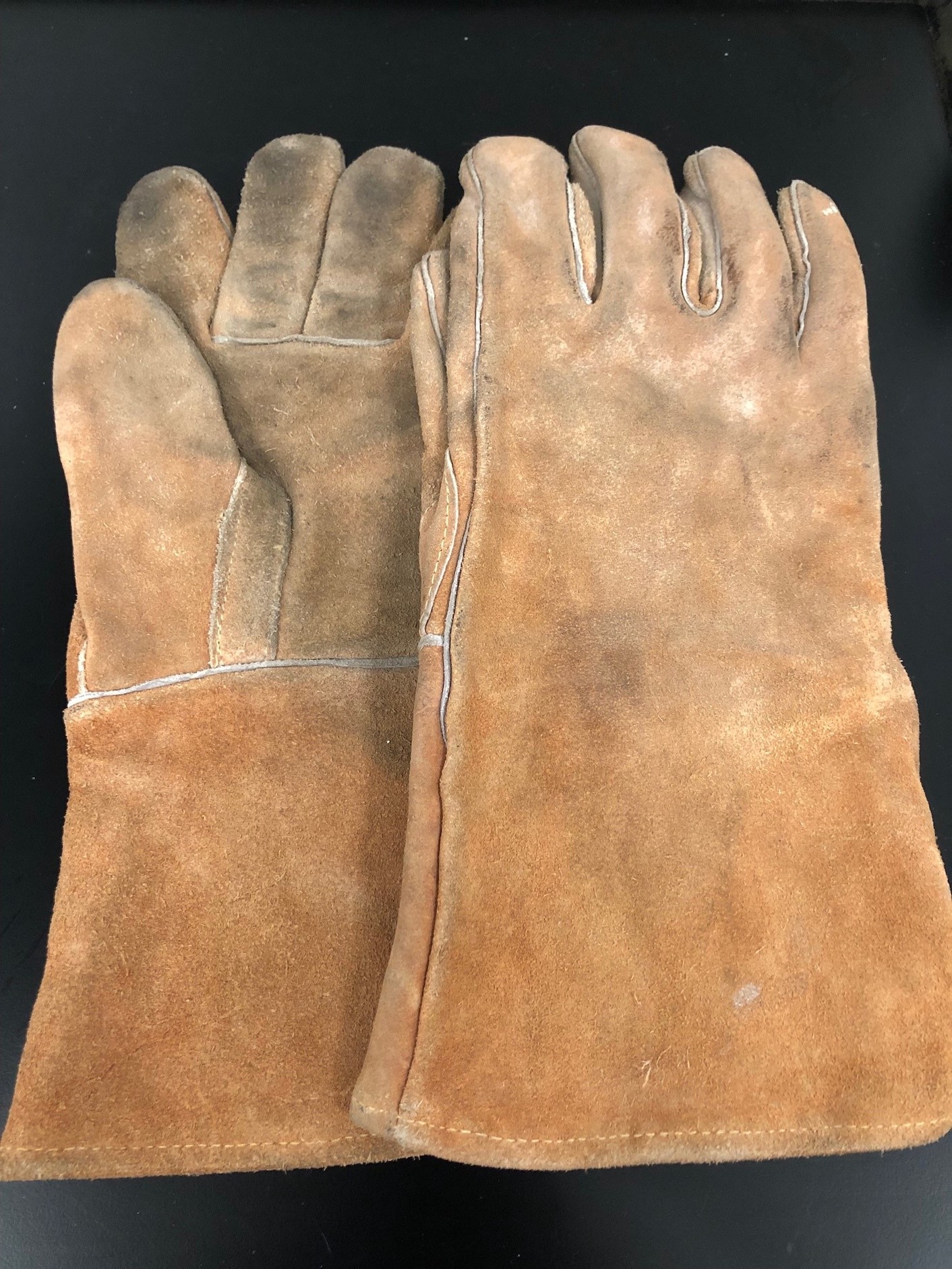 Battered welding gloves
