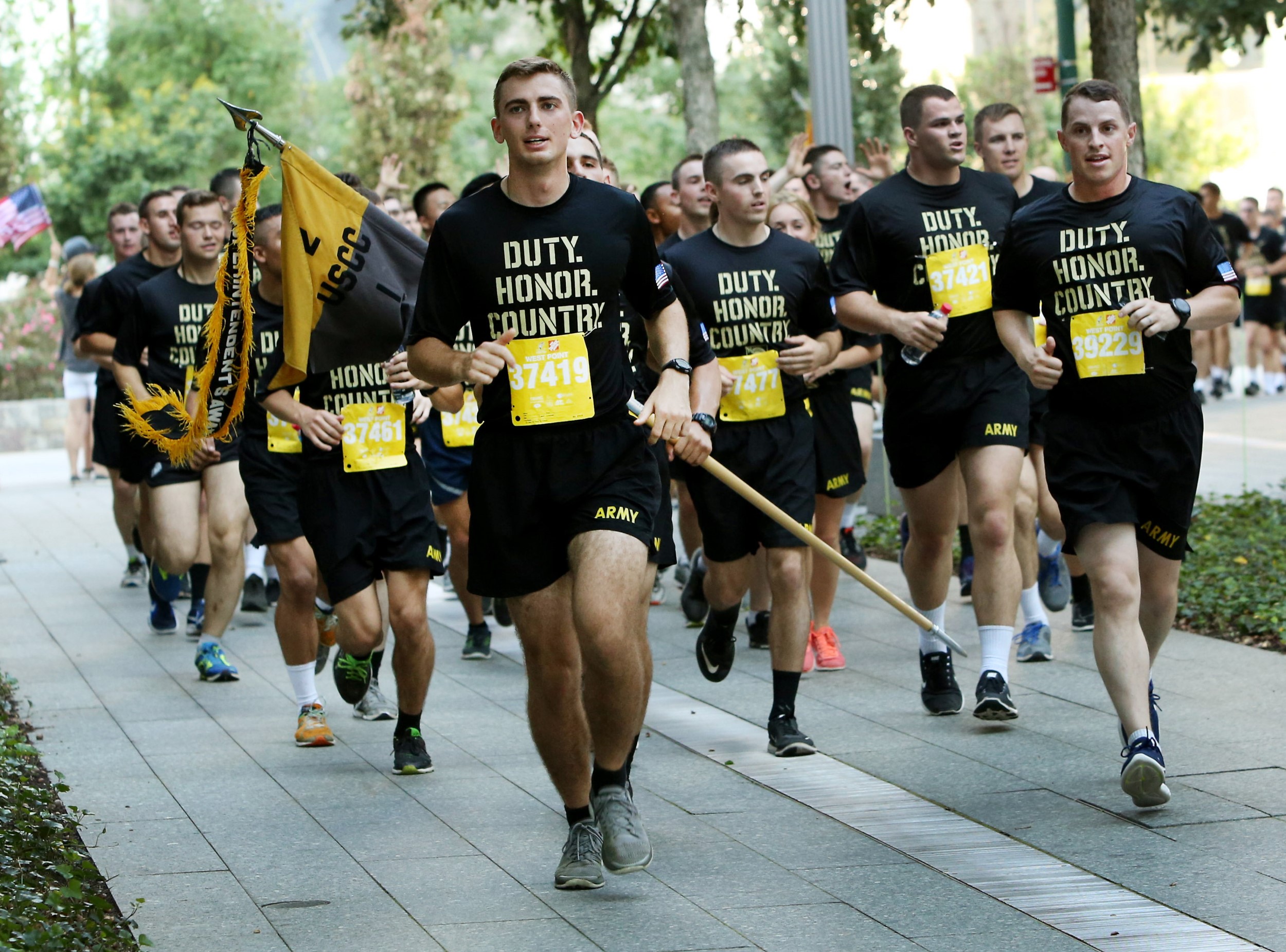 Dozens of West Point cadets in running outfits take part in the Tunnel to Towers 5K Run and Walk.