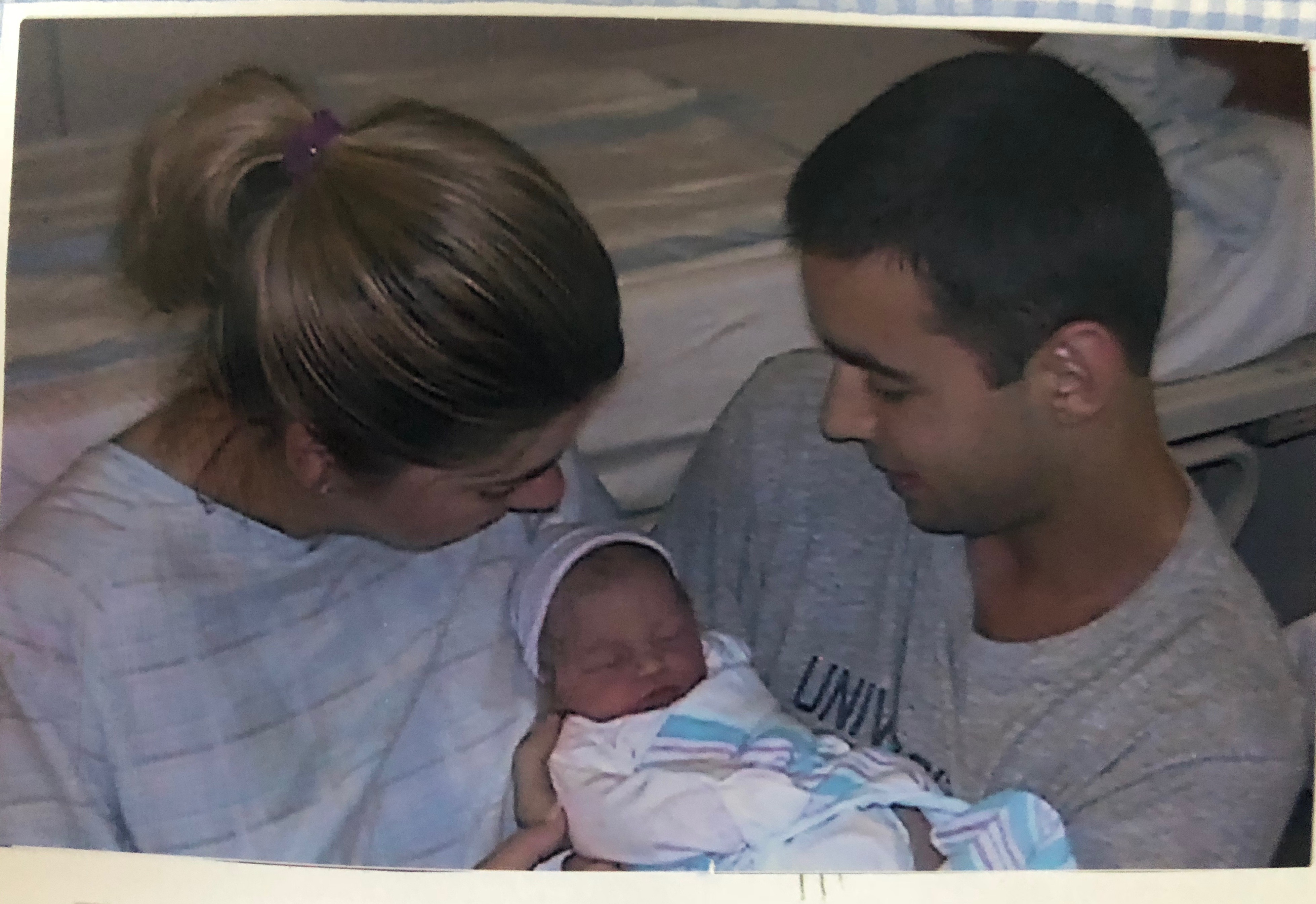 Jon and Erika Leiken hold their newborn daughter Caleigh.