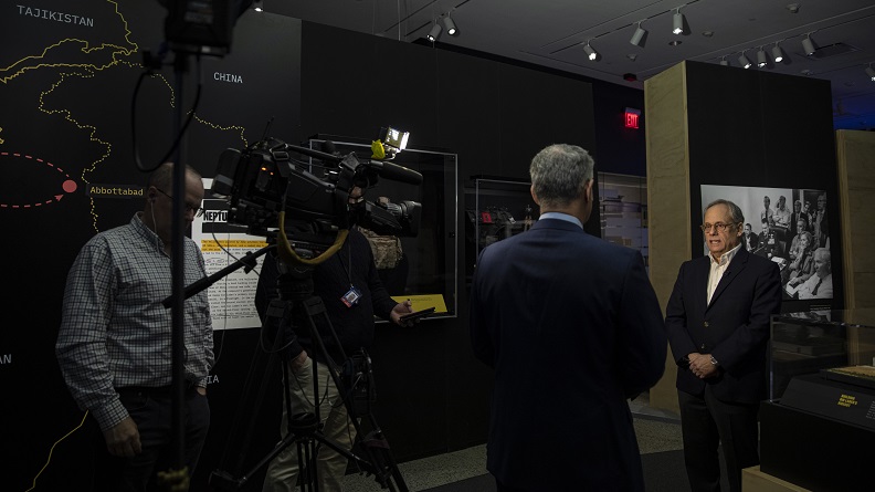 Cliff Chanin being interviewed in the "Revealed: The Hunt for Bin Laden" exhibition space during the press preview.