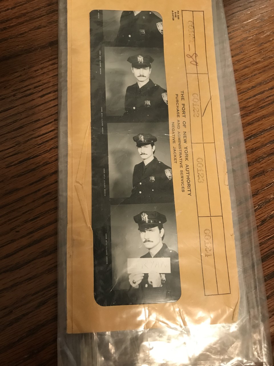 A strip of photos show a mustached man in a police uniform and hat