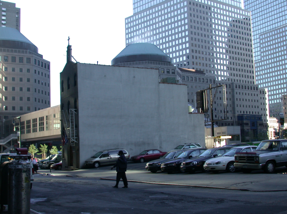 View of Greek Orthodox church in the early morning, against backdrop of lower Manhattan