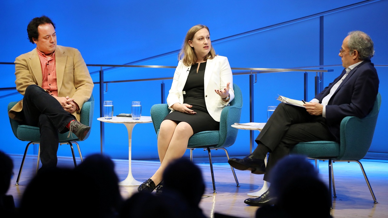 Devorah Margolin of George Washington University gestures as she speaks to Clifford Chanin, the executive vice president and deputy director for museum programs, onstage during a public program at the Museum auditorium. Graeme Wood of The Atlantic is seated next to her.