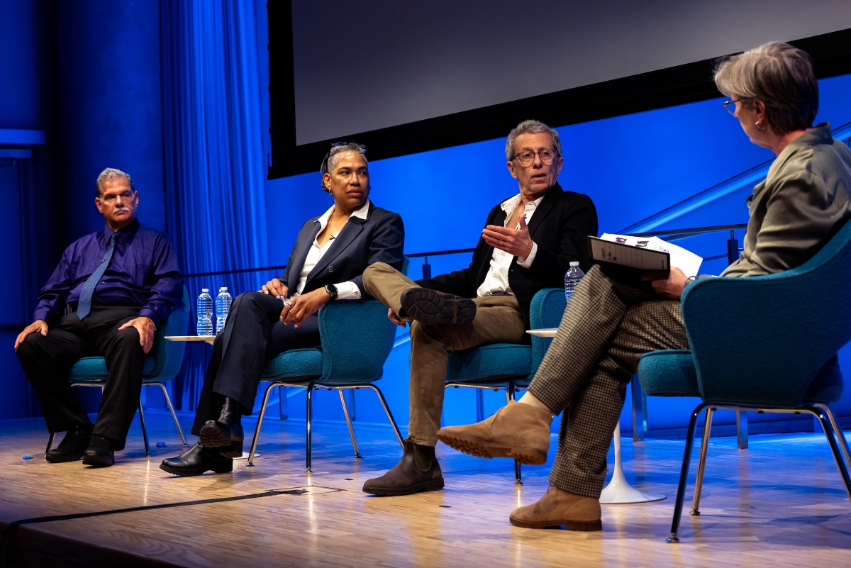 four people on stage 