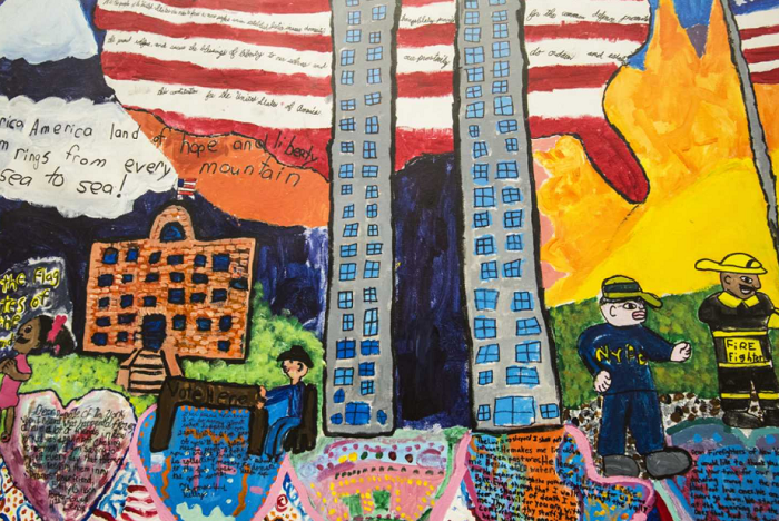 Detail shot of the children's mural, featuring the Twin Towers against an American flag background