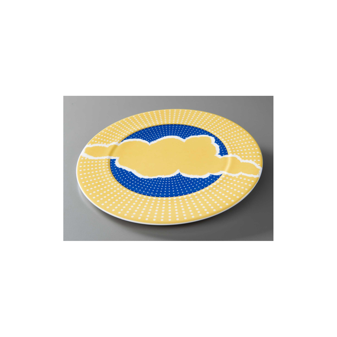 Plate charger designed for the Windows on the World restaurant. The charger is blue and yellow with a yellow cloud motif and small white dots that radiate from the center.