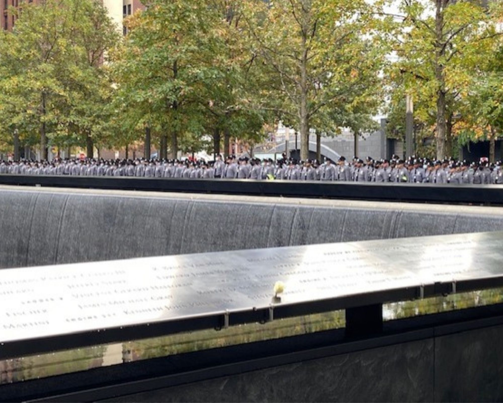 View of NYPD recruits from across the Memorial pool