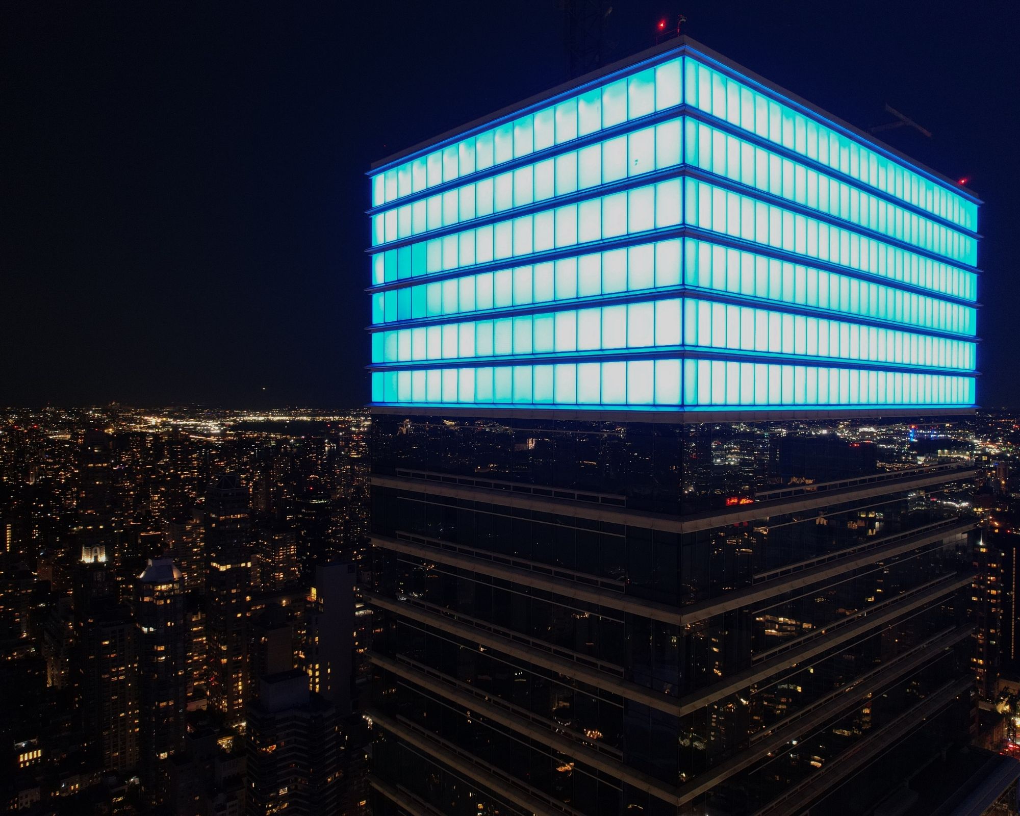 Manhattan skyscraper lit in blue