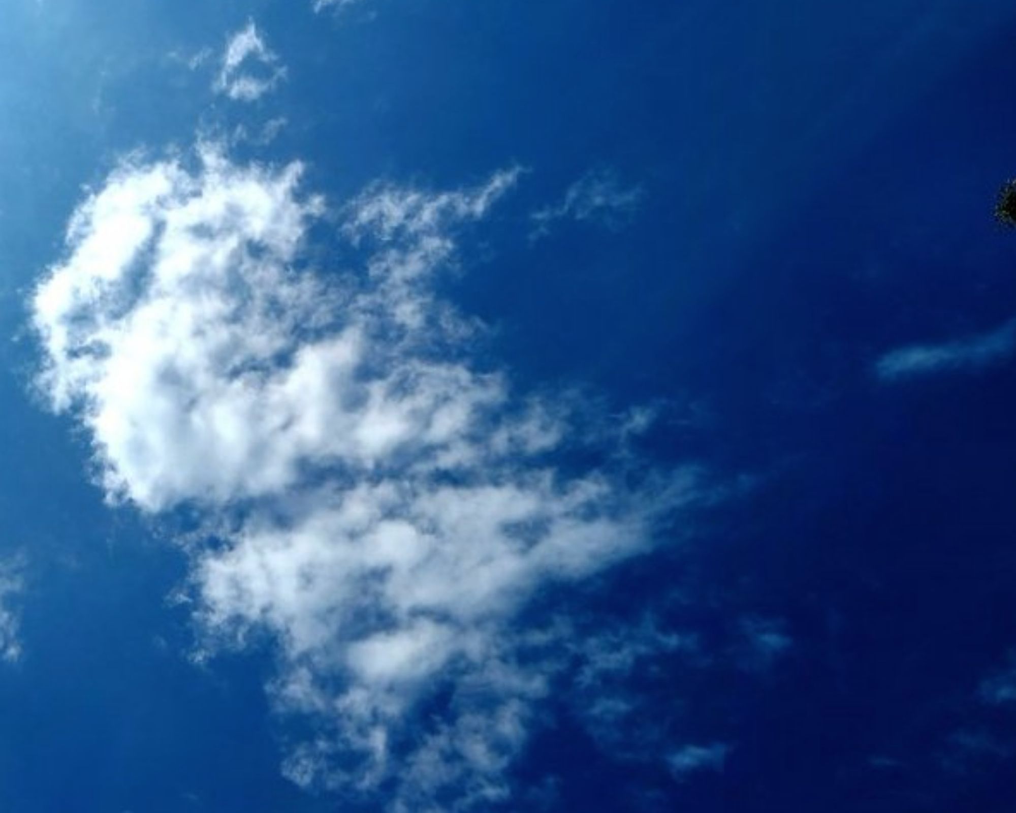 Blue sky with wispy clouds