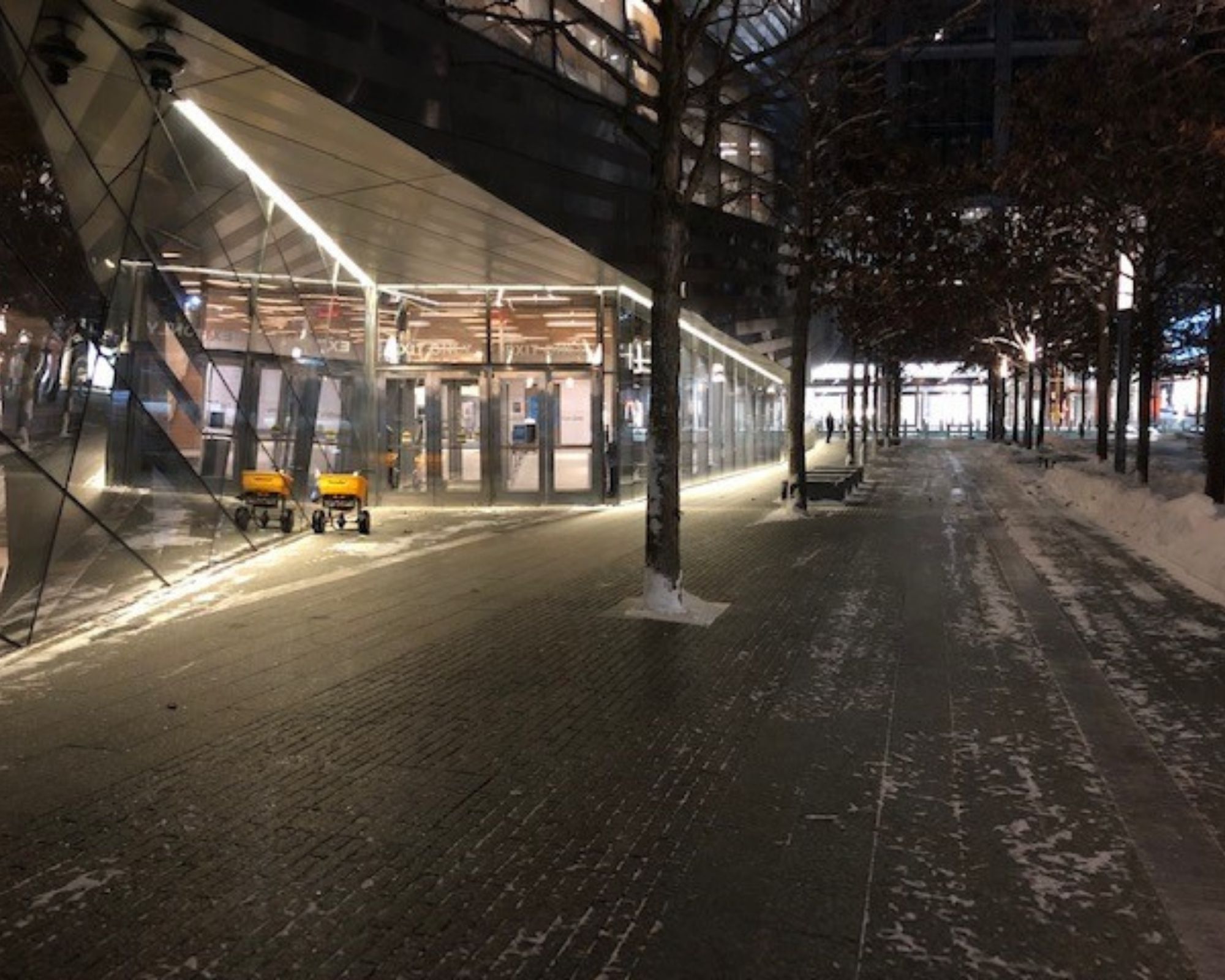 Nighttime on the Museum exterior, with path cleared of snow