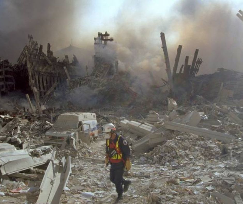 A rescue and recovery worker walking toward the pile at Ground Zero