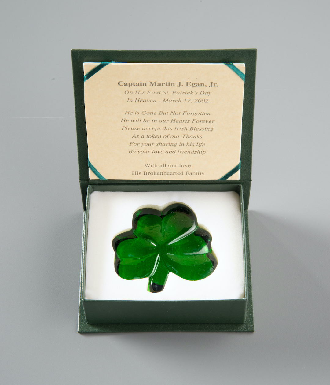 A green glass shamrock in memory of FDNY Captain Martin Egan is displayed in a custom-made case with an Irish blessing a message of remembrance. 