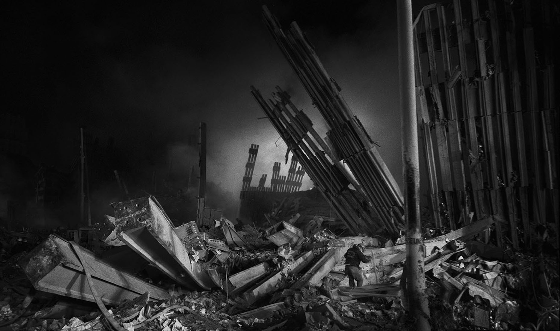 Black and white image of Ground Zero ruins at night.