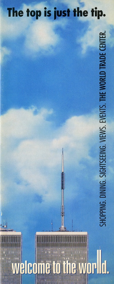 Brochure features the top of the Twin Towers below the blue sky. Printed text along three sides of the brochure read: "The top is just the tip" on the top, "Welcome to the world" on the bottom and "Shopping, Dining, Sightseeing, Views, Events, The World Trade Center" on the right.