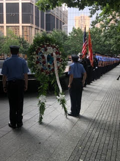 niformed FDNY and probationary EMTs prepare to lay a wreath at the Memorial.